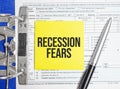 Recession fears words on paper notebook with pen Royalty Free Stock Photo
