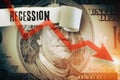 Recession word under the torn dollar bill. Economist forecast for the United States. Glowing red arrow going downwards on Benjami