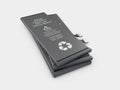 Rechargeable cell phone batteries. Isolated on gray background