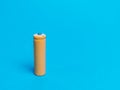 Rechargeable nicd AA size battery isolated on blue background.Rechargeable nicd AA size battery isolated on blue background. Royalty Free Stock Photo