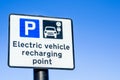 EV Recharging Point Sign and Blue Sky Royalty Free Stock Photo