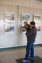 RECHITSA, Belarus - April 20, 2016: A boy ease behaves photo pictures at an exhibition in the cultural center of Black Gold