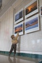 RECHITSA, Belarus - April 20, 2016: A boy ease behaves photo pictures at an exhibition in the cultural center of Black Gold