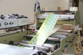 RECHITSA, BELARUS - April 12, 2013: Polygraphic machine for the production of trade stickers.