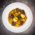Recipe for beer and mustard beef chuck stew with potatoes, turnips and carrots