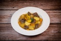 Recipe for beer and mustard beef chuck stew with potatoes, turnips and carrots