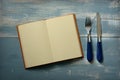 Recipe book with blank pages with fork and knife Royalty Free Stock Photo