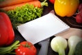 Recipe book with vegetables Royalty Free Stock Photo