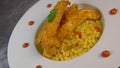 Recipe for chicken tenders with corn flakes and Italian Piombo pasta risotto and peppers on turntable