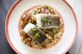 Cod loins cooked in the oven with quinoa and peach.