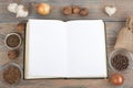 Recipe cook blank book on wooden background, spoon, rolling pin, checkered tablecloth