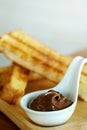 Recipe French Toast Sticks with hazelnut spread on wooden table