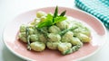 Gnocchi with yogurt and mint sauce with asparagus.