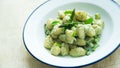 Gnocchi with yogurt and mint sauce with asparagus.