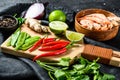 Recipe and ingredients Tom Kha Gai. Thai galangal chicken soup in coconut milk. Black background. Top view