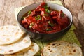 Recipe for Junglee Maas or Jungli Laal Maas close-up in the bowl. horizontal