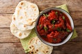 Recipe for Junglee Maas or Jungli Laal Maas close-up in the bowl. Horizontal top view