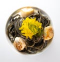 Recipe for Linguine Pasta with squid ink and scallops, yellow chioggia beet Royalty Free Stock Photo