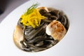 Recipe for Linguine Pasta with squid ink and scallops, yellow chioggia beet Royalty Free Stock Photo