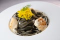 Recipe for Linguine Pasta with squid ink and scallops, yellow chioggia beet Royalty Free Stock Photo