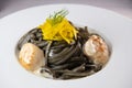 Recipe for Linguine Pasta with squid ink and scallops, yellow chioggia beet Royalty Free Stock Photo