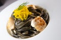 Recipe for Linguine Pasta with squid ink and scallops, yellow chioggia beet Royalty Free Stock Photo