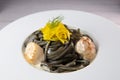 Recipe for Linguine Pasta with squid ink and scallops, yellow chioggia beet Royalty Free Stock Photo