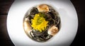 Recipe for Linguine Pasta with squid ink and scallops, yellow chioggia beet Royalty Free Stock Photo