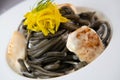 Recipe for Linguine Pasta with squid ink and scallops, yellow chioggia beet Royalty Free Stock Photo