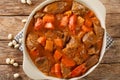 Recipe Mafe or Maafe West African meat in peanut sauce closeup in the pan. horizontal top view