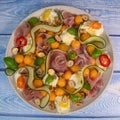 RECIPE FOR MELON, MOZARELLA, BASIL AND CURED HAM SALAD, CUCUMBER SLICE, ORANGE VINAIGRETTE