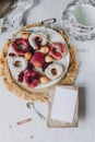 Recipe mockup, doughnut fried in glaze, on a plate on a white background, berry background