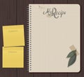 Recipe notebook with hand drawn text. Olive and laurel leaves with adhesive tape.