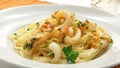Pasta frutti di mare with calamari and vegetables.