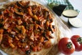 Pizza with roasted eggplant and tortilla sauce. Traditional Neapolitan pizza recipe.