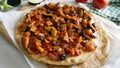 Pizza with roasted eggplant and tortilla sauce. Traditional Neapolitan pizza recipe.