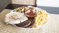 Plate with hamburgers, french fries and pita bread. Royalty Free Stock Photo