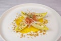 Recipe for salmon gravlax salad, endives filled with creame fresh, chives, yellow chioggia beetroot and leek shoots