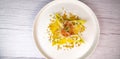 Recipe for salmon gravlax salad, endives filled with creame fresh, chives, yellow chioggia beetroot and leek shoots