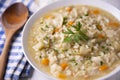 Soupy rice with vegetables, artichoke and carrot.