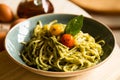 Spaghetti with pesto. Pesto is a typical condiment or sauce originating from Liguria. Its main ingredient is basil or better, Geno Royalty Free Stock Photo