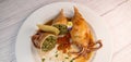 RECIPE FOR STUFFED SQUID, RIZOTTO AND SPINACH PESTO, HOMEMADE TOMATO SAUCE Royalty Free Stock Photo