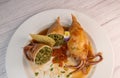 RECIPE FOR STUFFED SQUID, RIZOTTO AND SPINACH PESTO, HOMEMADE TOMATO SAUCE Royalty Free Stock Photo