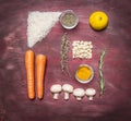 Recipe for vegetarian food rice, peanuts, lemon, spices, mushrooms, thyme, rosemary on wooden rustic background top view close up Royalty Free Stock Photo