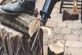 Reciprocating power saw sawing round timber closeup Royalty Free Stock Photo