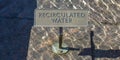 Recirculated water sign on glittering clear water Royalty Free Stock Photo