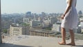 Reckless woman walks on edge of construction site no fear of height suicide fall