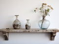 Reclaimed Wood Floating Shelf with Ornate Frames and a Tall Glass - AI Generated Royalty Free Stock Photo