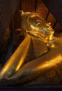 Reclining Buddha gold statue face Royalty Free Stock Photo