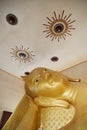 Reclining Buddha gold statue face. Bangkok, Thailand Royalty Free Stock Photo